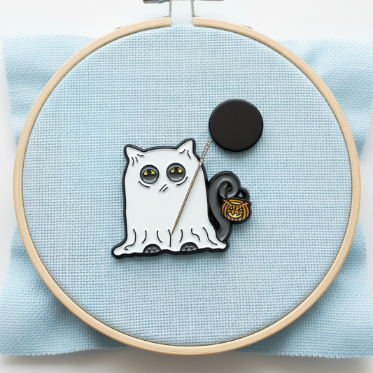 Glowing Ghost Cat Needle Minder in vibrant colors, perfect for organizing sewing needles.
